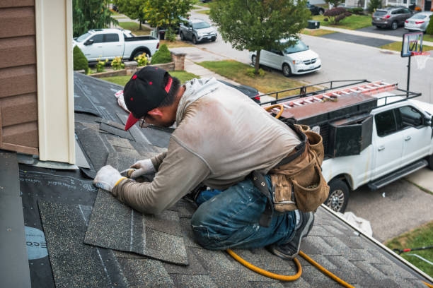 Professional Roofing technician working in Hines, OR